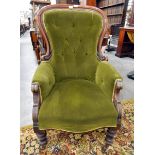 Victorian buttonback armchair with green upholstery, carved walnut frame,