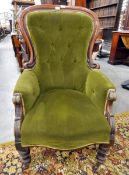 Victorian buttonback armchair with green upholstery, carved walnut frame,