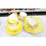 Shelley tea service of white ground with yellow handpainted borders,