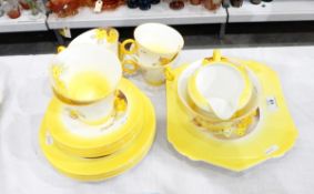 Shelley tea service of white ground with yellow handpainted borders,