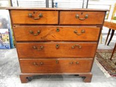 Early 19th century mahogany straight-front chest of two short and three long graduated drawers,
