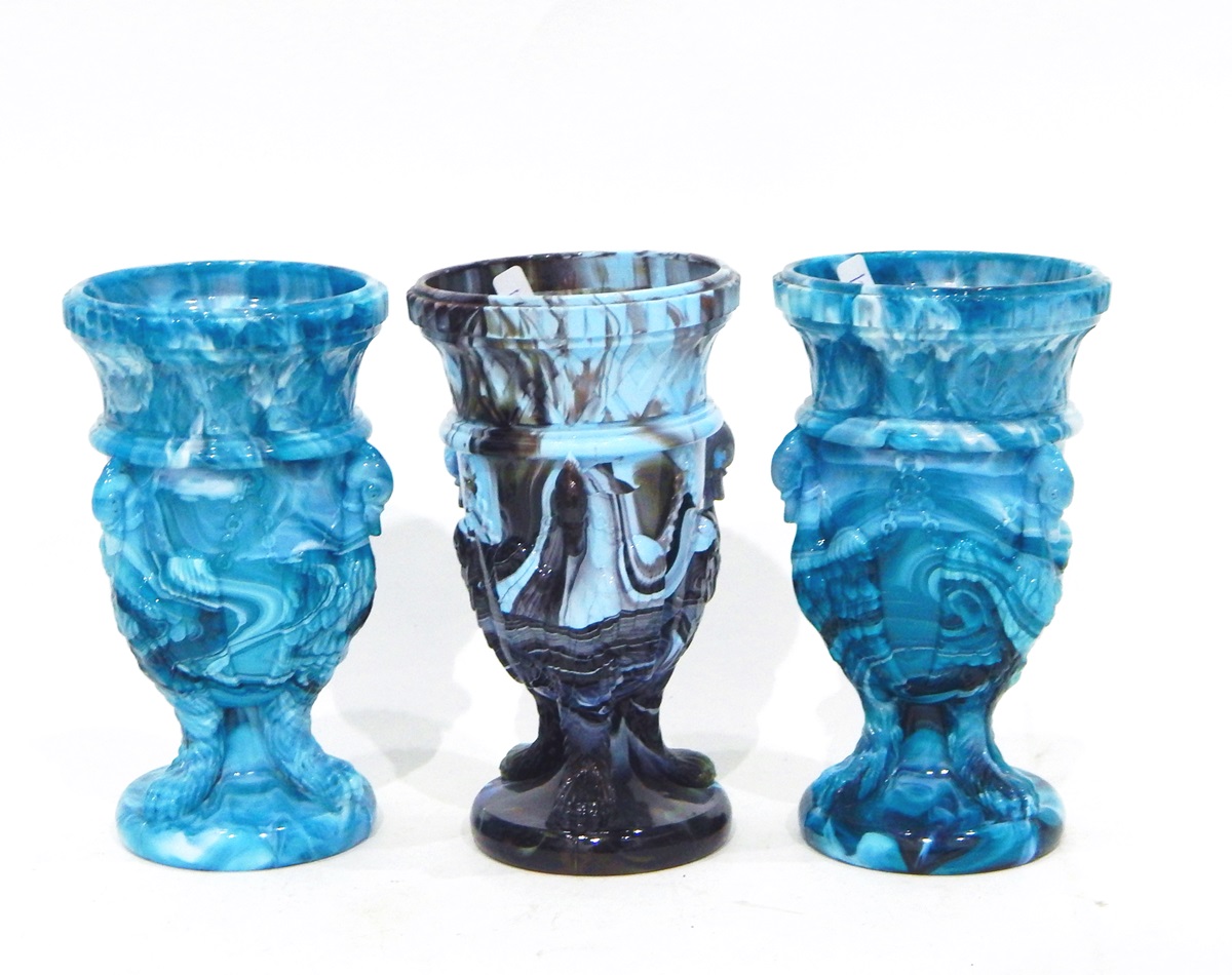 Pair of Victorian blue marbled pressed glass vases, each modelled with chained swans,