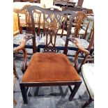 Chippendale-style mahogany elbow chair with pierced Gothic splat, upholstered drop-in seat,