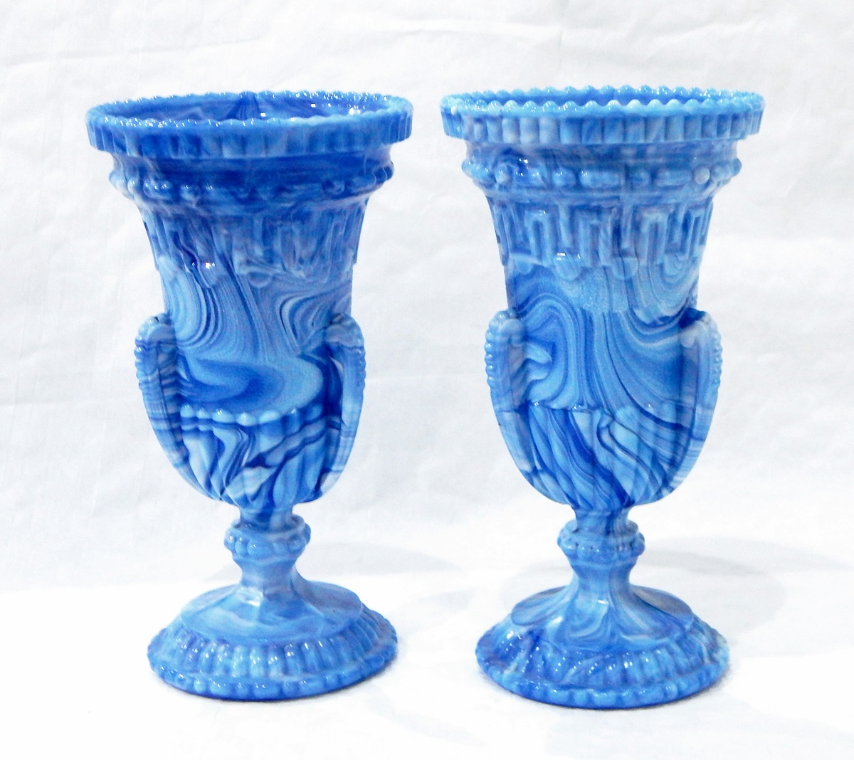 Pair of Victorian blue marbled pressed glass vases of urn form with borders of Greek key pattern, - Image 2 of 3