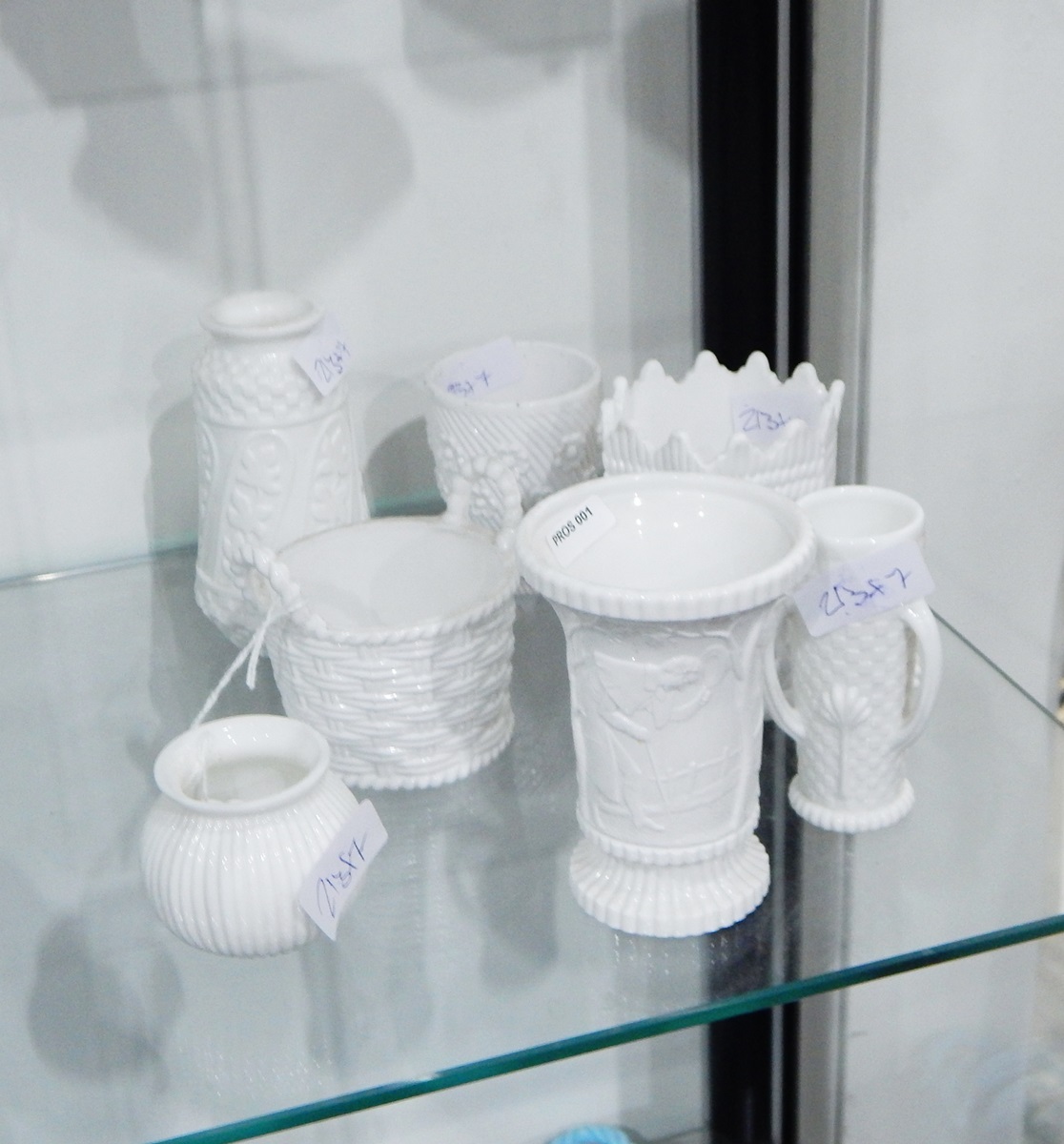 Collection of Victorian opaque white pressed glass including a Sowerby vase of flared circular form