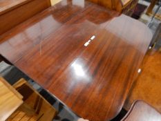 Mahogany fall-flap dining table supported on shaped standards,
