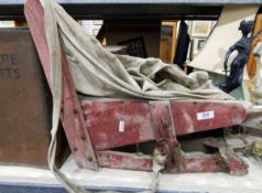 Metal tin marked 'Welfare Biscuits', an old seed spreader,