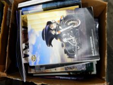 Large collection of books on Harley Davidson motorcycles and a quantity of DVDs including box set