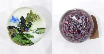 Large glass paperweight, painted internally with a Chinese mountain landscape on a white ground,