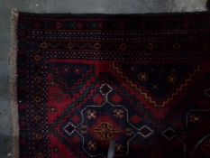 Handmade Eastern wool rug with dark blue ground, red zig-zag central field, geometric design,