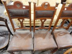Three Edwardian pad back dining chairs with rexine upholstered seats, two bentwood chairs,