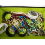 A quantity of costume jewellery, including bead bangles, Murano glass necklaces etc.