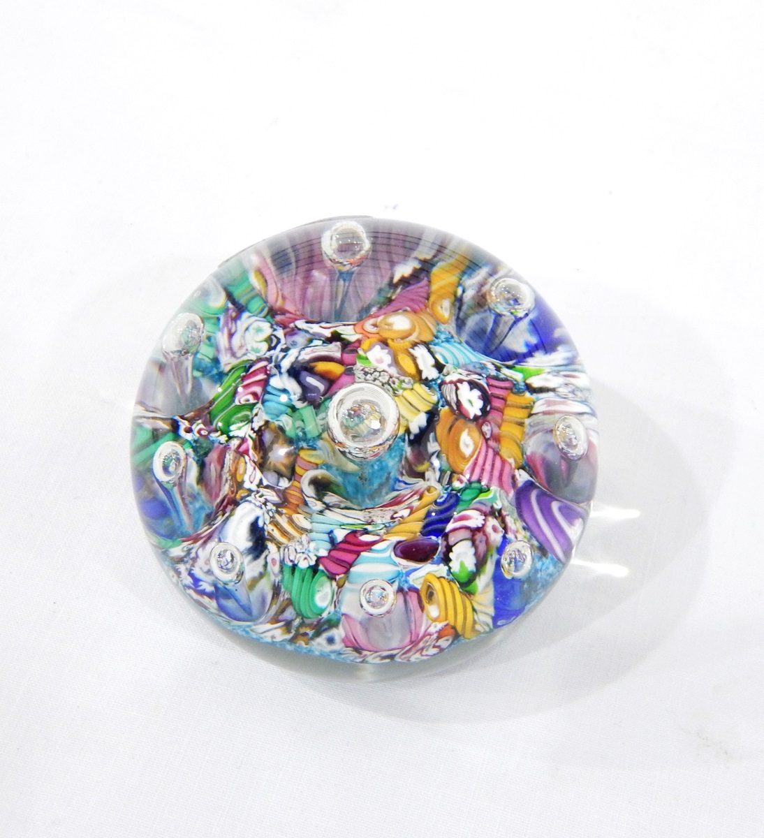 Glass paperweight, with scrambled millefiori canes surmounted by clear glass teardrops,