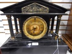 Victorian slate mantel clock, of temple design supported by columns,