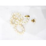 Cultured pearl necklace and a pair similar earrings,