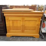 Modern pale chestnut side cupboard by Simon Knowles, with a pair of cushion frieze drawers,