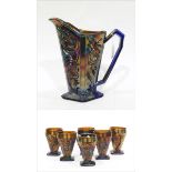 Blue carnival glass jug moulded with stylised flowers and six matching goblets (7)