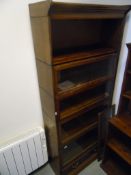 Oak Globe Wernicke-style four height bookcase, with glazed fronts,
