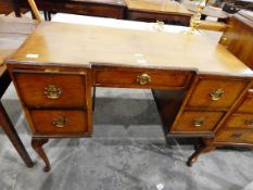 Circa 1940's/early 50's walnut veneered inverted breakfront dressing table on cabriole supports and
