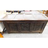 Early 18th century three-panelled carved oak coffer with a four-panelled cover and on stile feet,