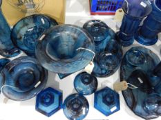 Large quantity of blue cloud glass including sundae dishes, trumpet vases, candlesticks, pin trays,