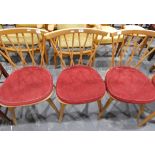 Set of four beech splat back dining chairs, the solid seats with cushions,