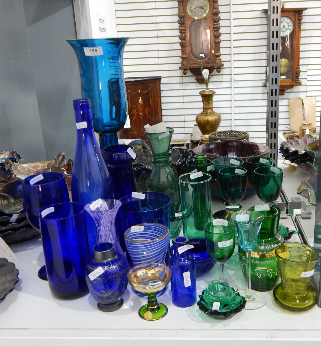 Quantity of green and blue coloured glass to include a large blue glass storm lantern,