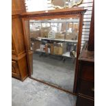A late 19th century walnut framed wall mirror with dentil cornice,