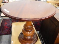 Mahogany circular top side table on turned bulbous pedestal and circular foot,