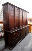 Large 19th century oak breakfront housekeeper's cupboard with three panelled cupboards enclosing