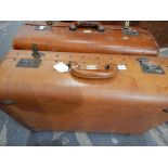 Two vintage leather suitcases labelled 'Garstin' and another leather suitcase (3)