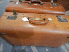 Two vintage leather suitcases labelled 'Garstin' and another leather suitcase (3)