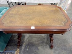 Lady's mahogany writing table, the shaped top with tooled leather writing surface,