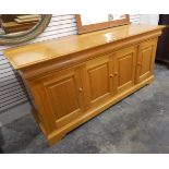 Modern pale chestnut sideboard by Simon Knowles, with three cushion frieze drawers,