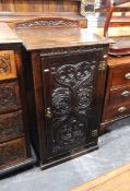 19th century carved oak side cupboard with floral carved back,
