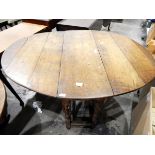 18th century oak gateleg table with drop-leaf oval top, on turned baluster supports, frieze drawer,