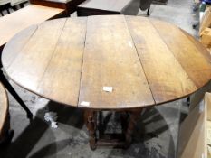 18th century oak gateleg table with drop-leaf oval top, on turned baluster supports, frieze drawer,