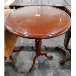 Circular mahogany pedestal tripod table on spiral turned column,