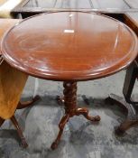 Circular mahogany pedestal tripod table on spiral turned column,