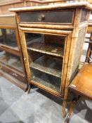 Victorian/Edwardian bamboo-framed cabinet, enclosed by glass panelled doors and with frieze drawer,