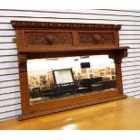 A Victorian carved oak overmantel mirror with dart and bead cornice,