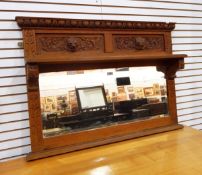 A Victorian carved oak overmantel mirror with dart and bead cornice,