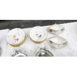 Set of 15 KPM porcelain plates, each painted with posies of flowers with insects,