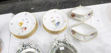 Set of 15 KPM porcelain plates, each painted with posies of flowers with insects,