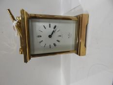 Brass carriage clock, the dial with Roman numerals and inscribed St James, London,