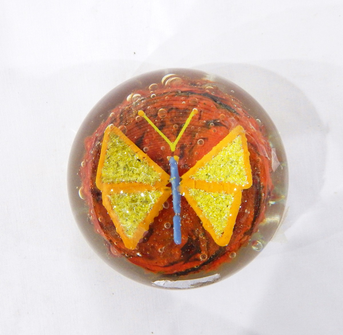 Glass paperweight, of circular form with central butterfly decoration,