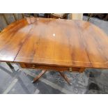 Reproduction-style yew veneered pedestal fall-flap Pembroke-style table fitted a drawer to frieze