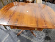 Reproduction-style yew veneered pedestal fall-flap Pembroke-style table fitted a drawer to frieze