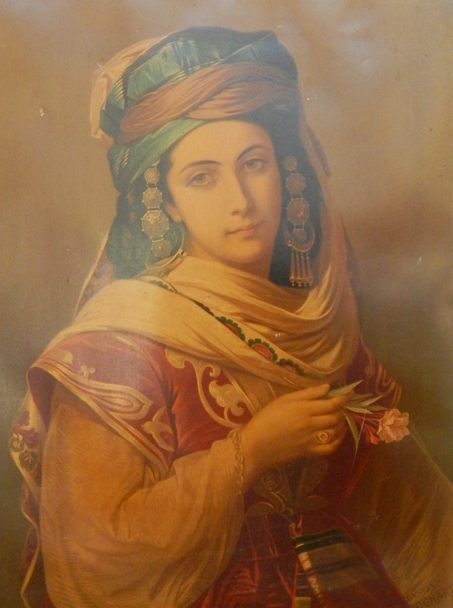 After Constant Brochart Chromolithograph Lady in traditional costume holding a flower,