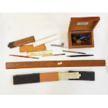 Assorted wooden rulers,